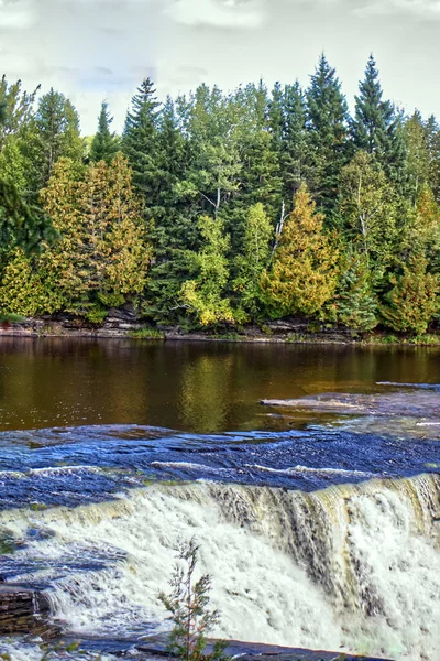 Sliding down the flat rocks before the huge fall - Kakabeka Falls, Thunder Bay, ON, Canada