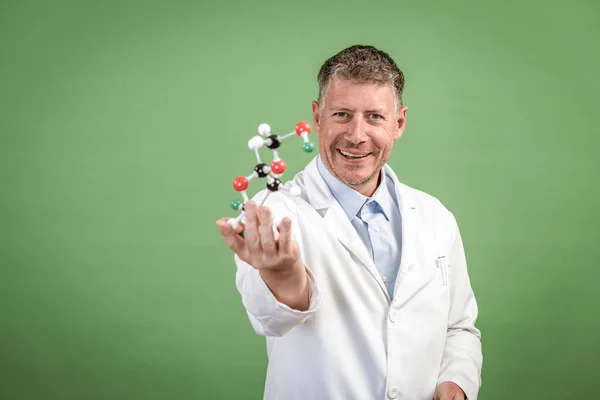 Scientist White Coat Holds Model Molecules Hand Stands Front Green — Stock Photo, Image