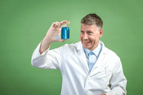 Scientist White Coat Holding Small Flask Blue Liquid Standing Front — Stock Photo, Image