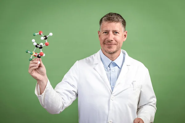 Scientist White Coat Holds Model Molecules Hand Stands Front Green — Stock Photo, Image