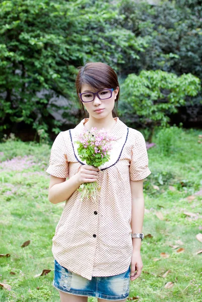 Girl with flowers — Stock Photo, Image