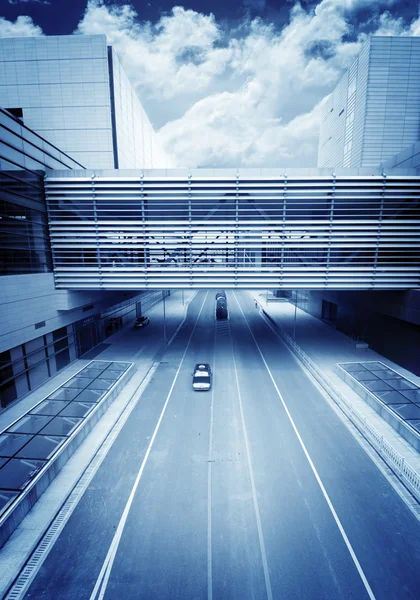 Road go through the modern office building at shanghai airport. — Stock Photo, Image