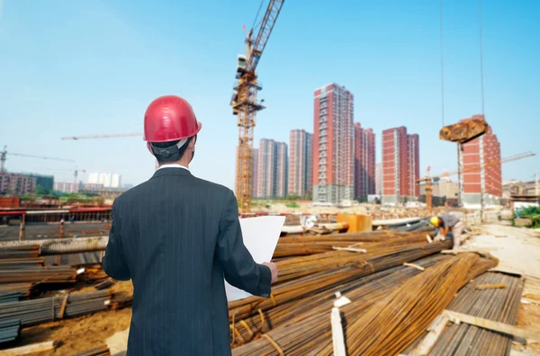 Architect looking comparing housing project — Stock Photo, Image