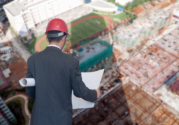 Architect looking comparing housing project — Stock Photo, Image