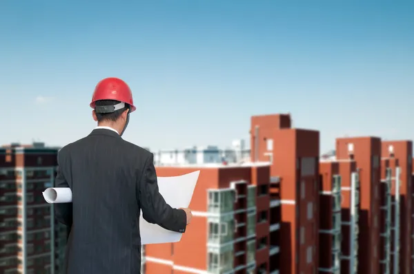 Architect looking comparing housing project — Stock Photo, Image