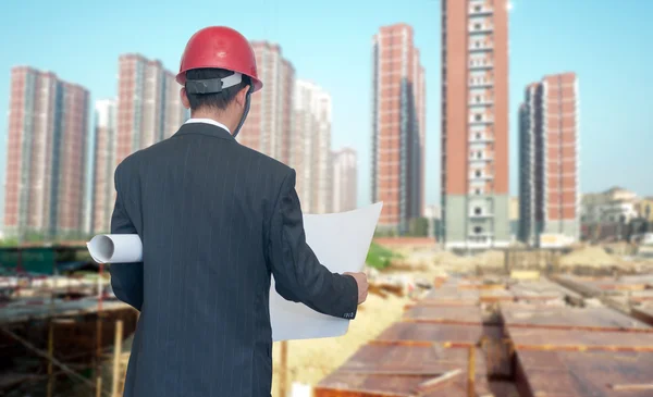 Architect looking comparing housing project — Stock Photo, Image