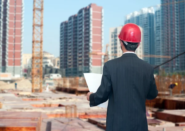 Architect looking comparing housing project — Stock Photo, Image