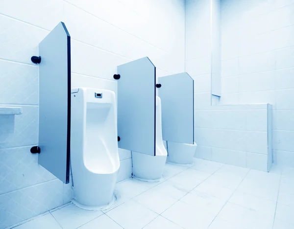 White porcelain urinals in public toilets — Stock Photo, Image