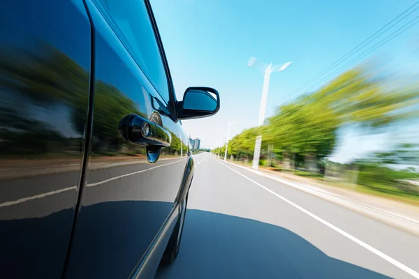 Car on the road with motion blur background — Stock Photo, Image