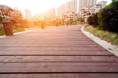 Platform beside lake with sunset in park