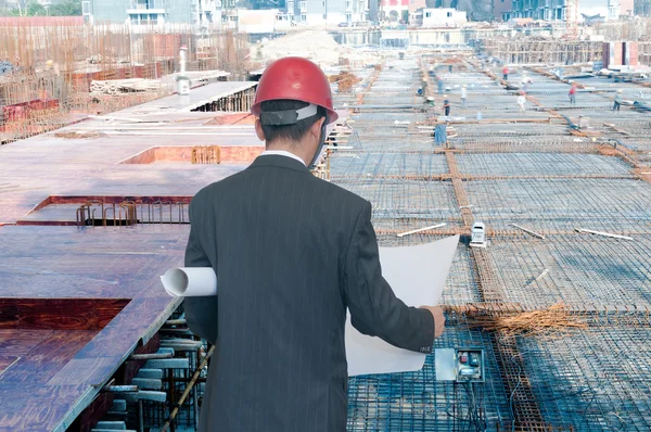 Architect looking comparing housing project — Stock Photo, Image