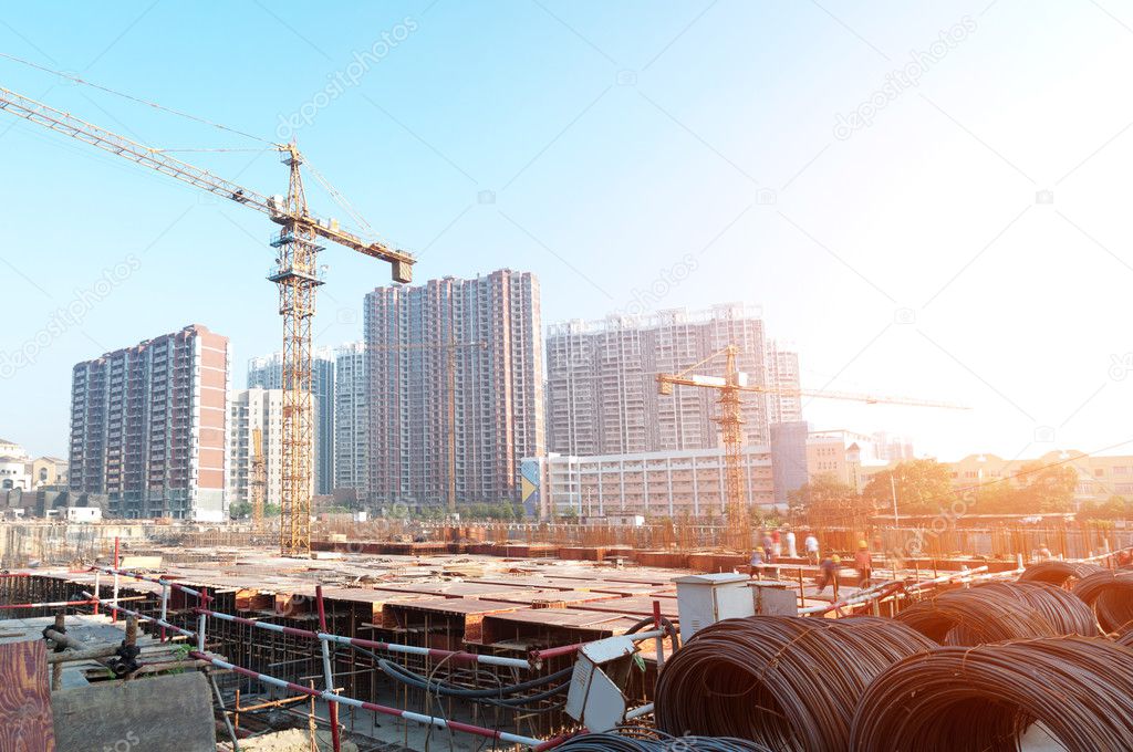 Building under construction with workers