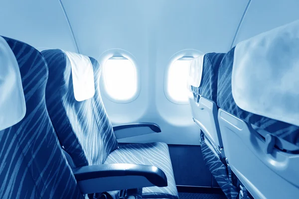 Empty aircraft seats and windows — Stock Photo, Image