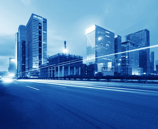 Light trails on the street at dusk — Stock Photo, Image