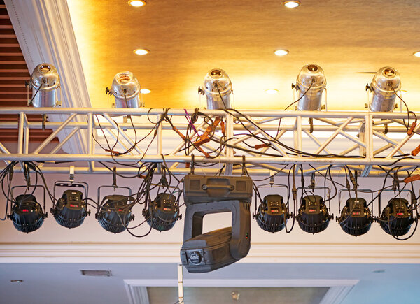 Studio lighting equipment high above an outdoor theatrical perfo