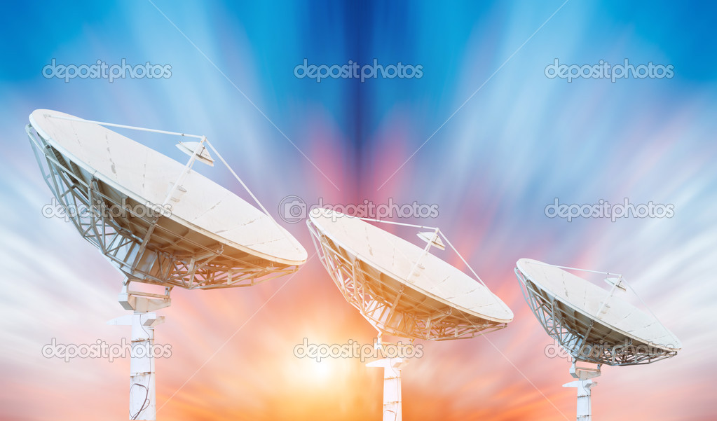 Satellite dish antennas under sky