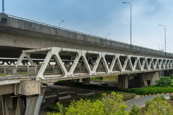 Pedestrian bridge against blue sky