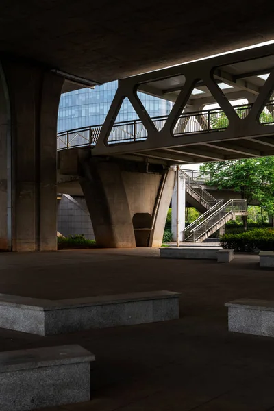 Concrete structure and asphalt road space under the overpass in the city