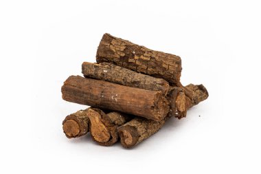 Set with dried sticks of mulethi or Glycyrrhiza glabra root on white background