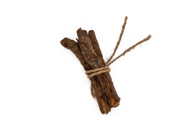 Set with dried sticks of mulethi or Glycyrrhiza glabra root on white background