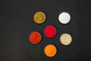 Pile of delicious colorful, tasty candies of different shapes on black background