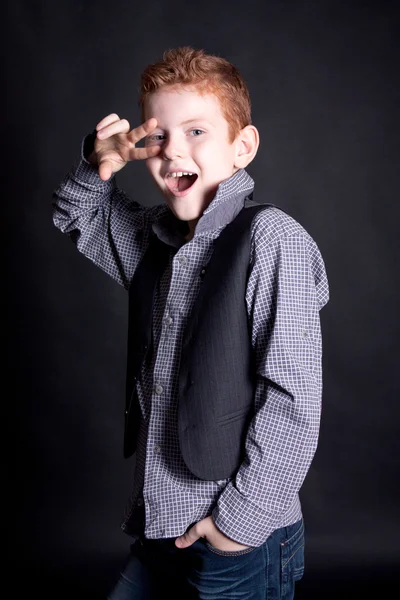 Emotional red-haired boy in the studio — Stock Photo, Image