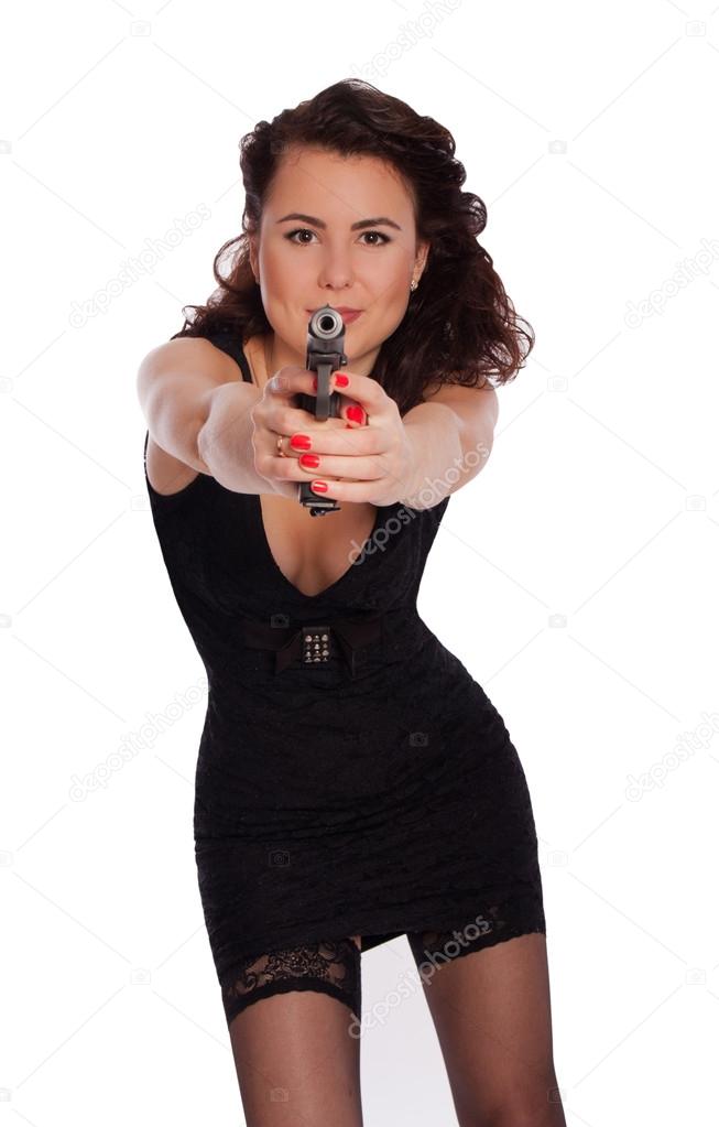 Sexy woman in black dress with a gun.