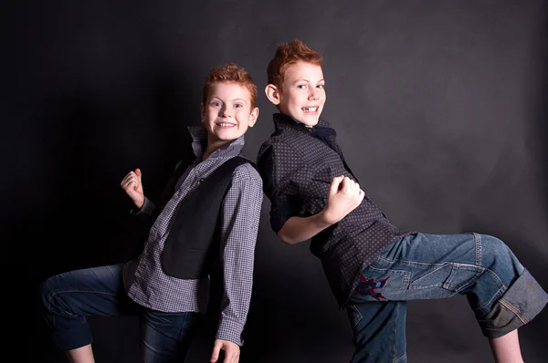 Cheerful red-haired boys on a black background — Stock Photo, Image