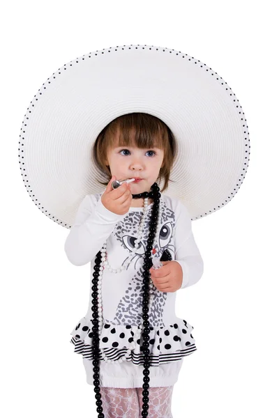 Pequeña hermosa fashionista. Preciosa niña aislada en blanco . — Foto de Stock