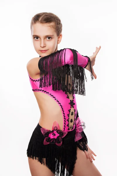 A tánc a lány rózsaszín ruha, a fehér háttér — Stock Fotó