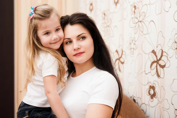 Portrait of young mother and her small daughter. — Stock Photo, Image