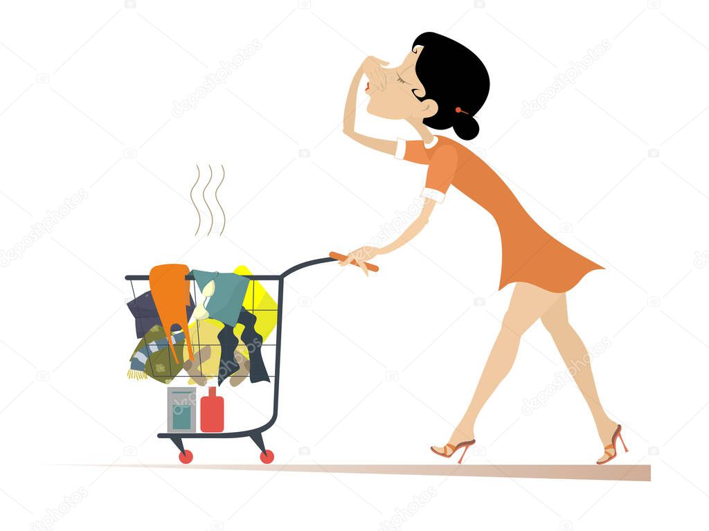 Woman with a trolley going to wash dirty laundry. Young woman moves a trolley with dirty laundry and holds her nose from odor nuisance isolated on white