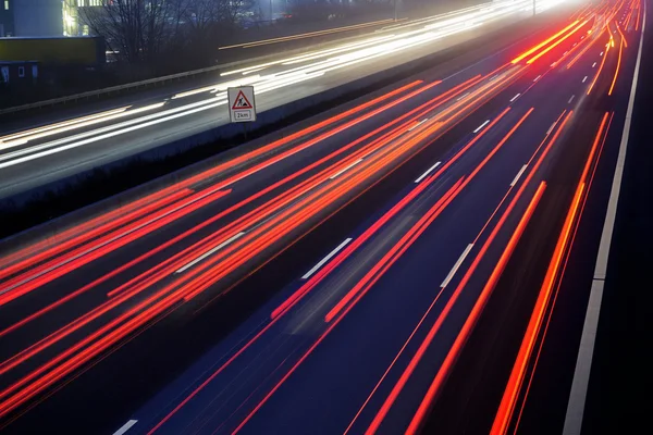 Light trail view at a busy highway — Stock Photo, Image