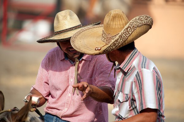 Mexican charros horsemen chatting in sombreros, TX, US