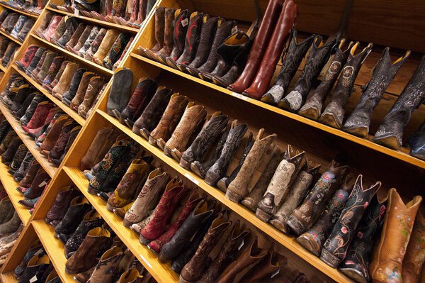 Cowboy boots line the shelves, Austin, Texas, US