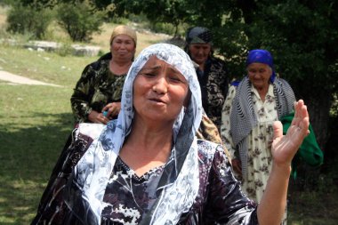 Uzbek women in Arslanbob, Kyrgyzstan clipart