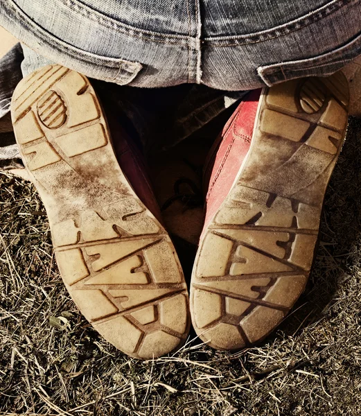 Girl sitting on her feet outdoor — Stock Photo, Image