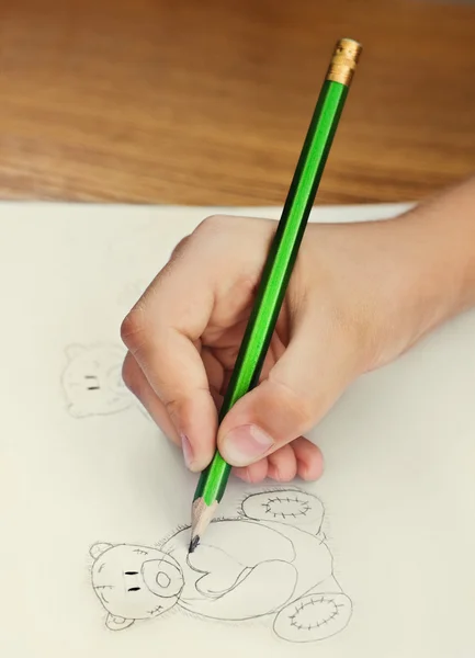 Child drawing teddy bears