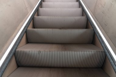 at the station have an escalator next to the stairs