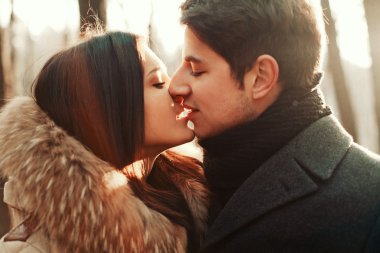 Sensual outdoor portrait of young couple in love