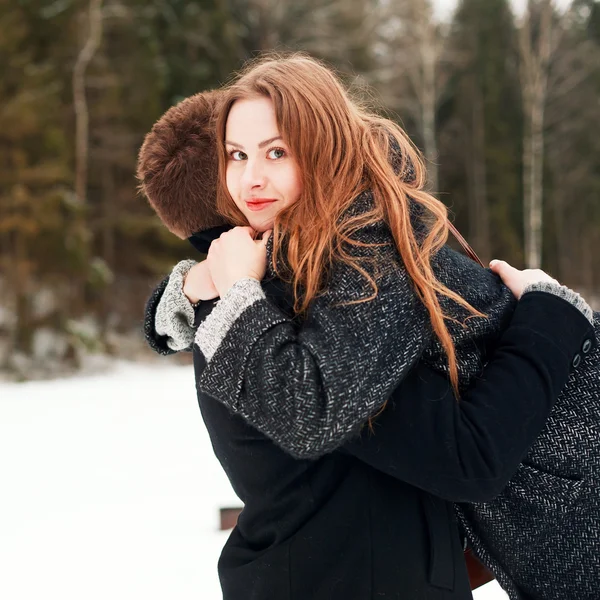 Young beautiful blonde hanging her boyfriend — Stock Photo, Image