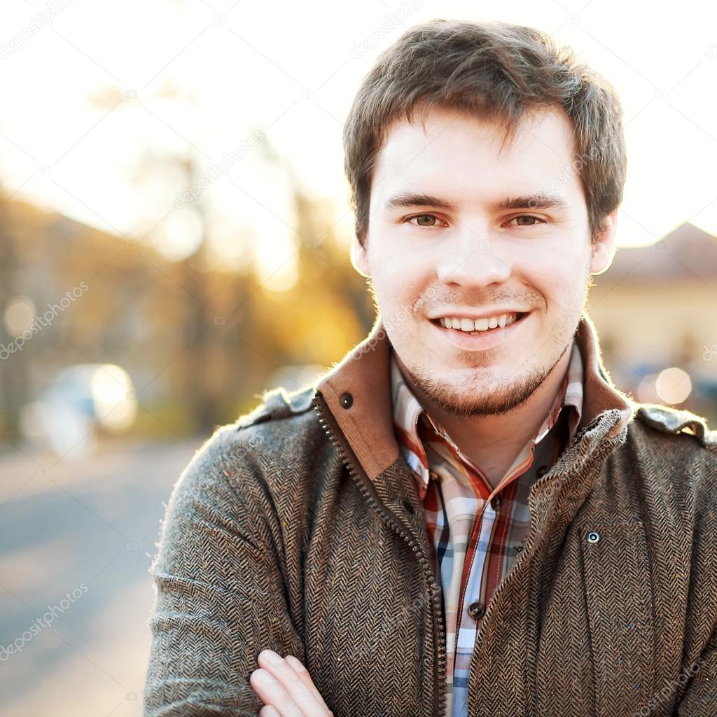 Handsome man outdoors portrait.