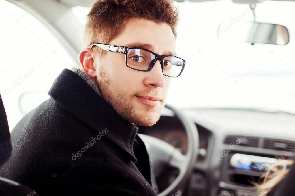 man driving a car