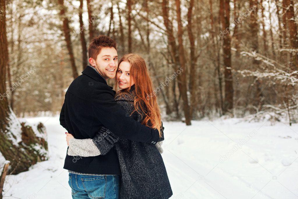 Couple in love in the cold spring forest