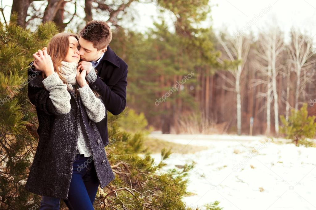 Couple in love in the cold spring forest