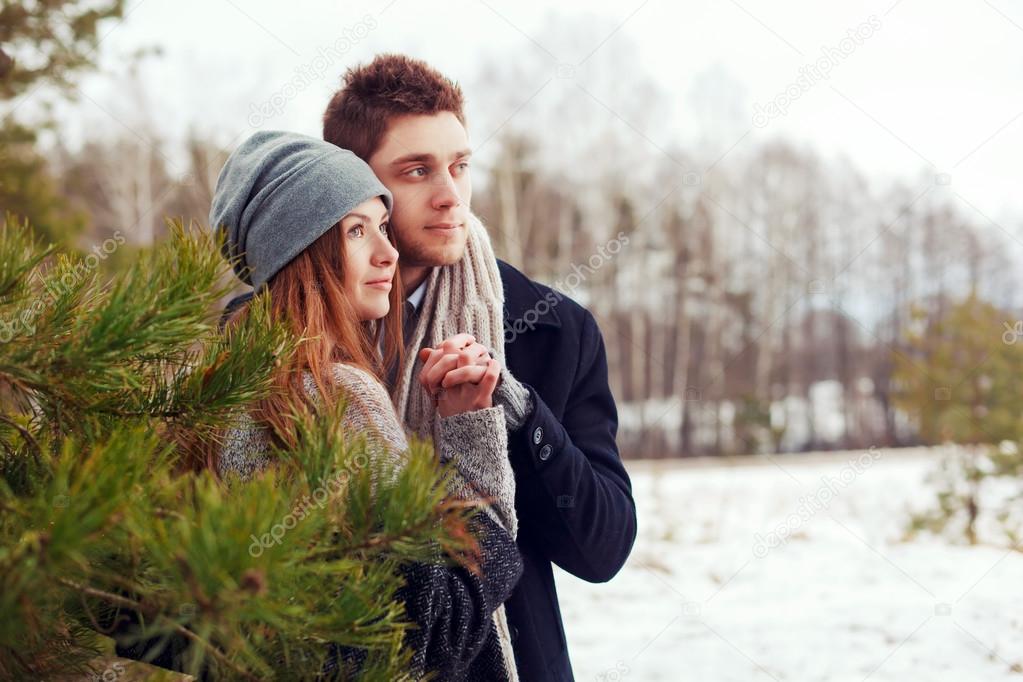 couple in love in the cold spring forest
