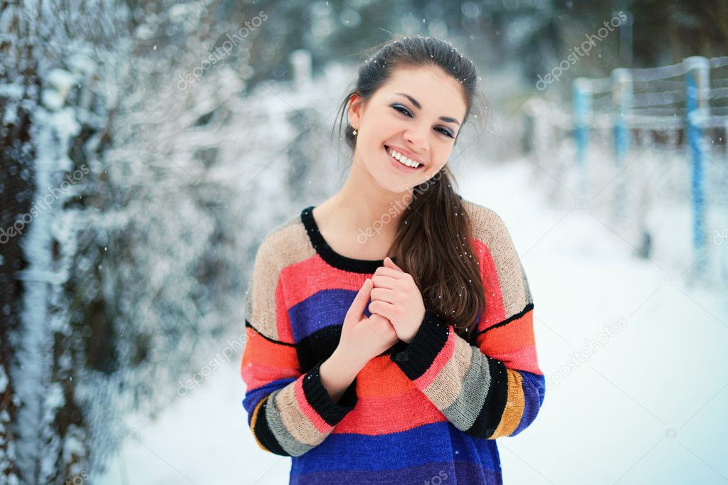 woman, dressed in colorful sweater.