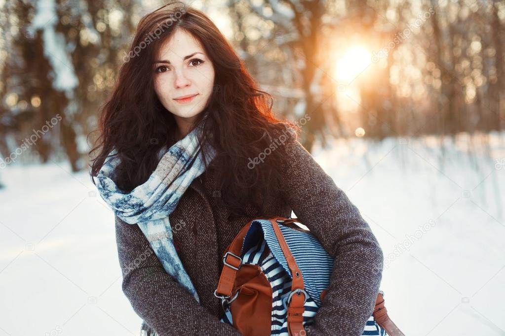 girl walks in winter park.