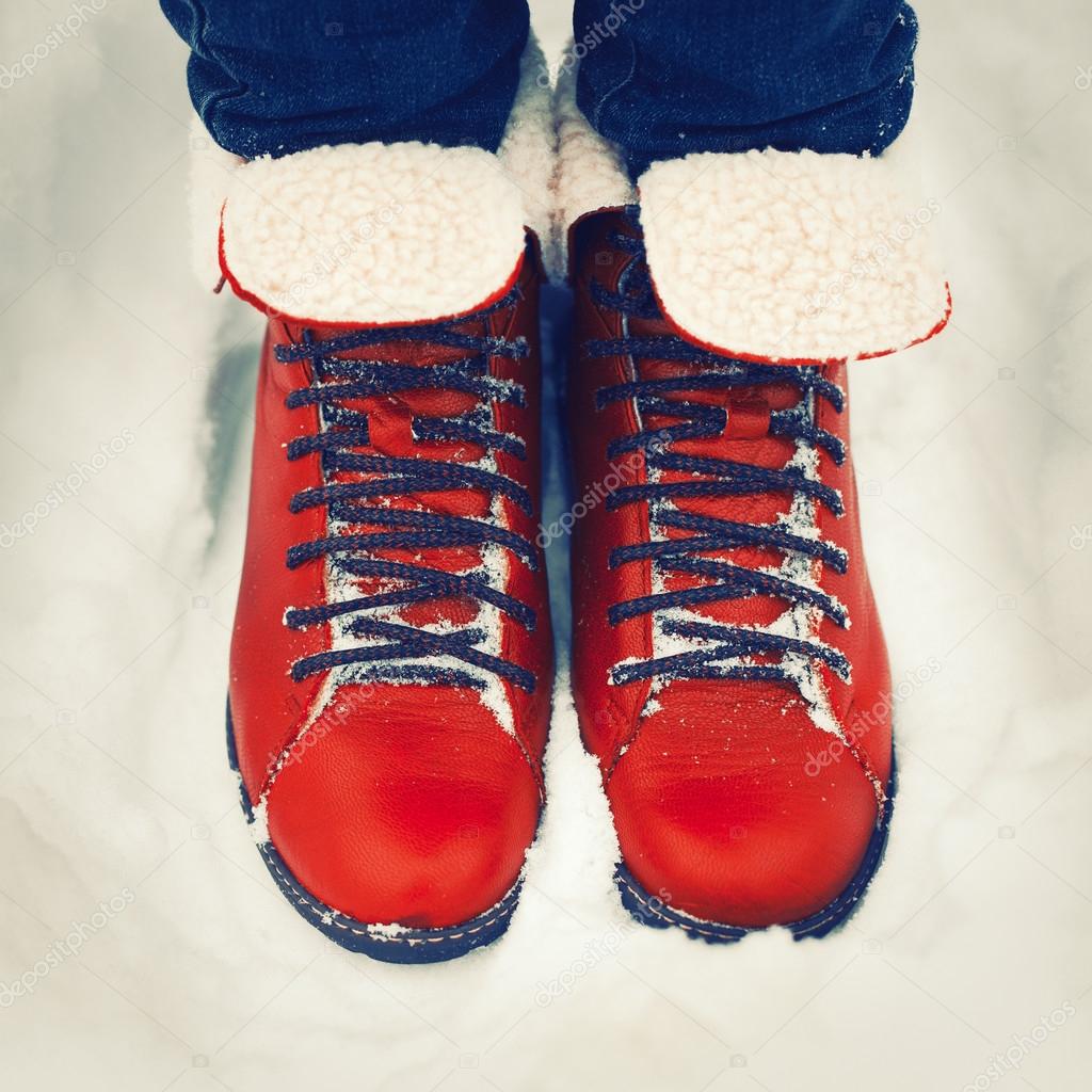 red vintage boots on the snow.