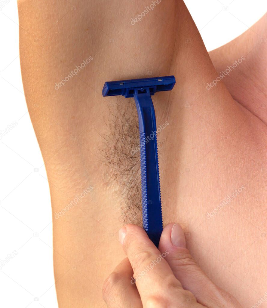 Isolated woman hand holding razor to shave hairy unshaved armpit holding arm straight on white background